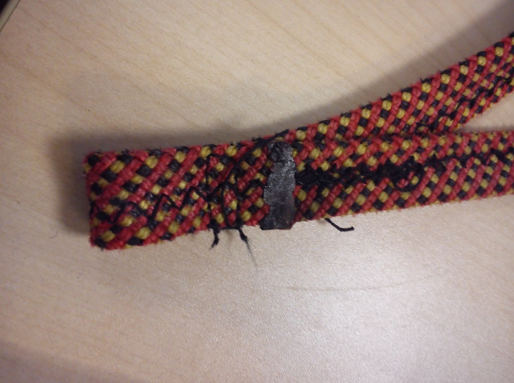 Key ring goes into the loop on the left side. Hence Mobius formation.